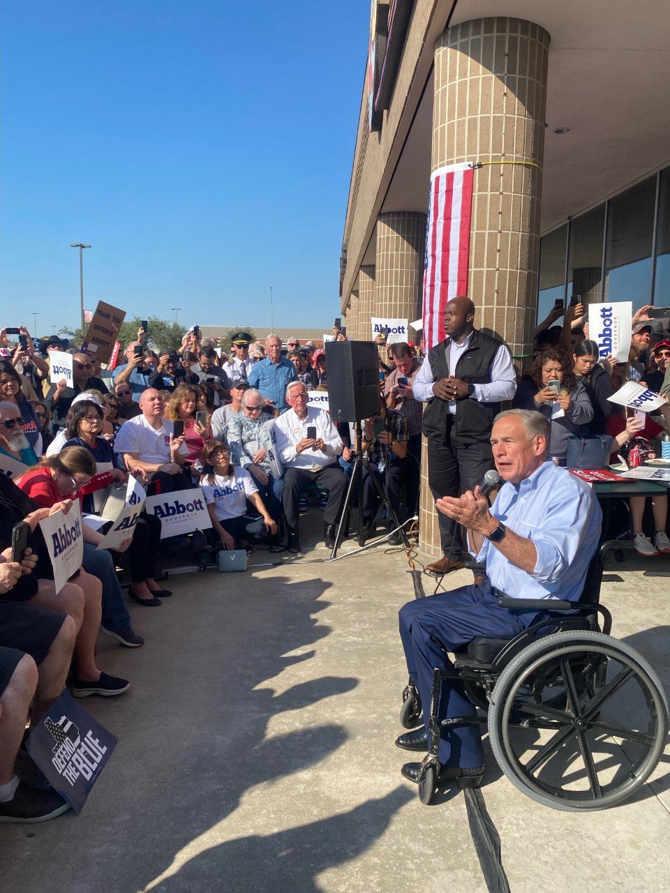 Gov. Greg Abbott spoke at an October 27 rally in front of Fuzzy’s Pizza and Italian Café, 613 S. Mason Road.